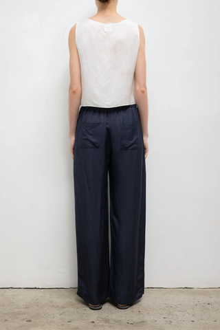 back profile model wearing  Daniel Crop Sleeveless Crew Top Cropped, boxy fit
Sleeveless
Round neckline
Medium width straps
Italian-crafted lightweight linen