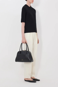 side profile model wearing Dara Cashmere Black 100% Cashmere
Straight fit
Elbow-length raglan sleeves
Crew neck with rib details
