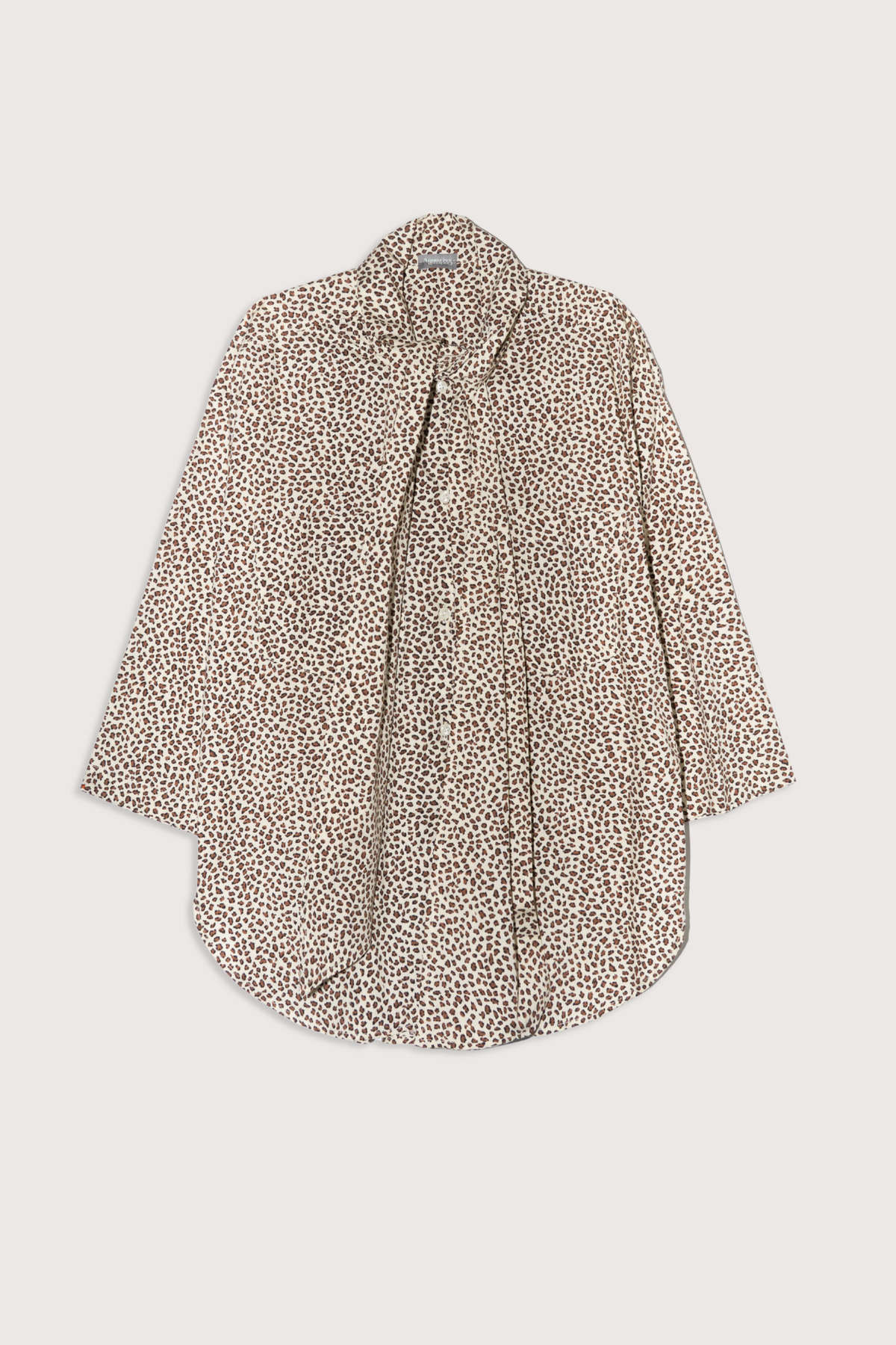 flat lay Dear Polly With Tie Shirt cheetah print Button front
Long neck ties: keep them loose or tie them off kilter in a sloppy bow.
Two front pockets and long-ish shaped hemline 
100% Cotton Poplin