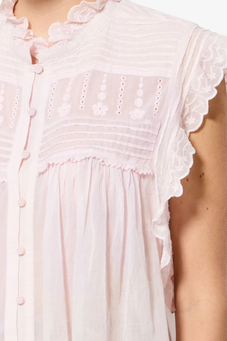 close detail for Dersia Sleeveless Embroidered Top Light Pink cotton voile
Straight fit
Front button closure
Pleated and embroidered bib
High round neckline with embroidered ruffle
Pleated shoulders
Ruffled armholes
Curved hem
100% Cotton