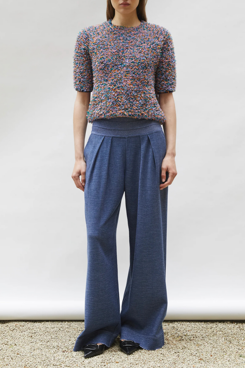 front profile model wearing Desperado Textured Elbow Top Indigo Multi  satin-stitched tulle yarn 