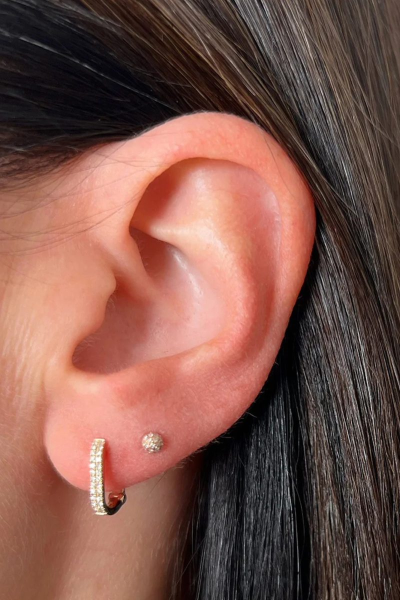model wearing Diamond Lola Huggie Earring (Pair) yellow gold Diamond Lola Huggie
Two rows of pavé diamonds
Diamond weight: 0.12 carats for the pair
Earring height: 12 mm
Huggie inner diameter: 7.5 mm
Finished with a latch closure
