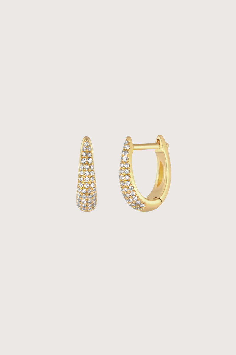 flat lay Diamond MIni Maeve Huggie Earring (Pair) yellow gold Diamond weight: 0.17 carats for the pair
Outer diameter: 12 mm
Finished with a latch closure
