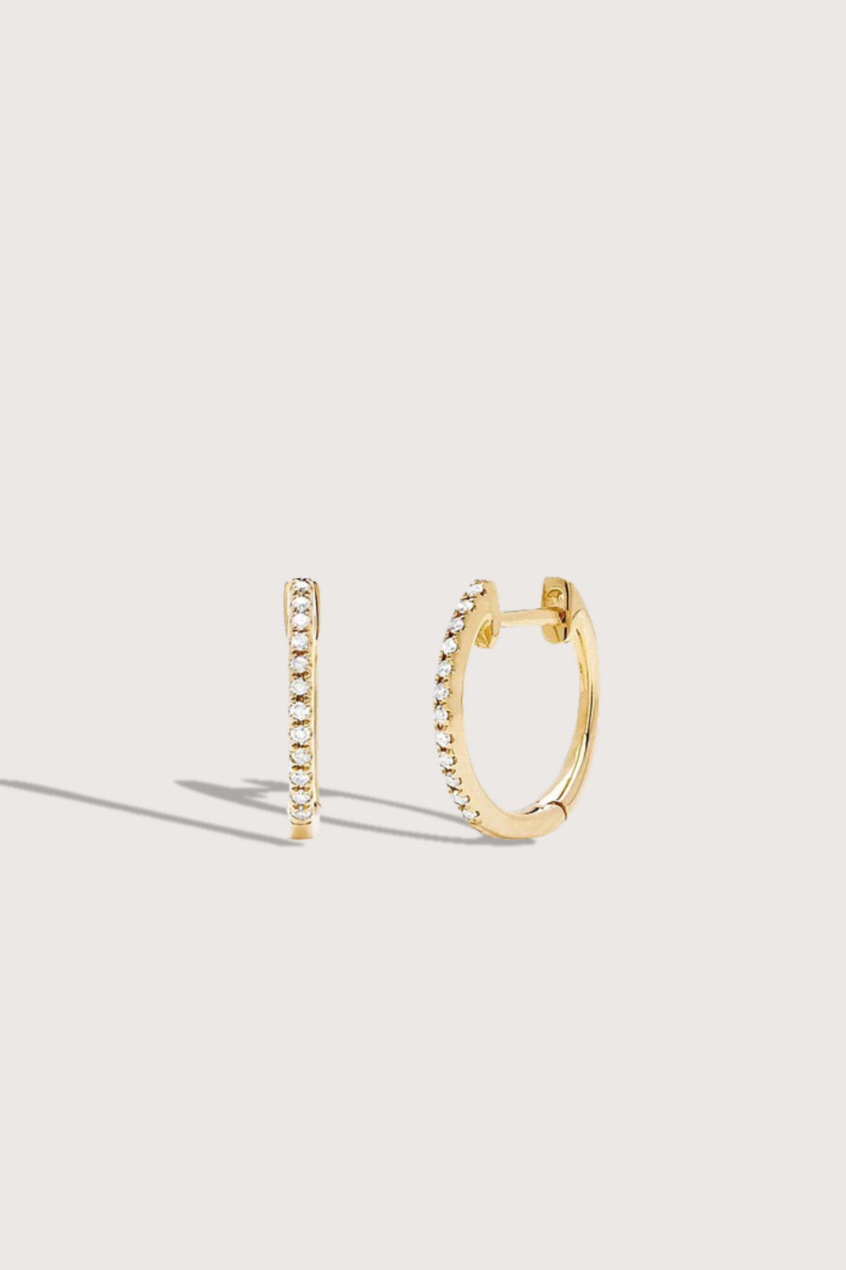 flat lay Diamond Mini Huggie Earring Yellow Gold (Single) 14k gold