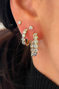model wearing Diamond Studs 14k gold