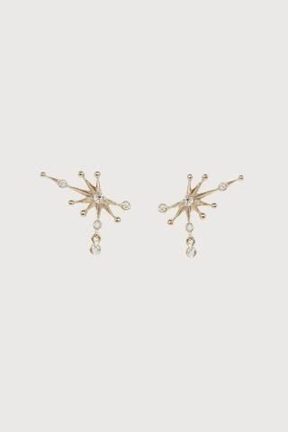 flat lay Diamonds Constellation Earrings 14k light yellow gold
Five white diamonds
One dangling diamond constellation single stud earrings