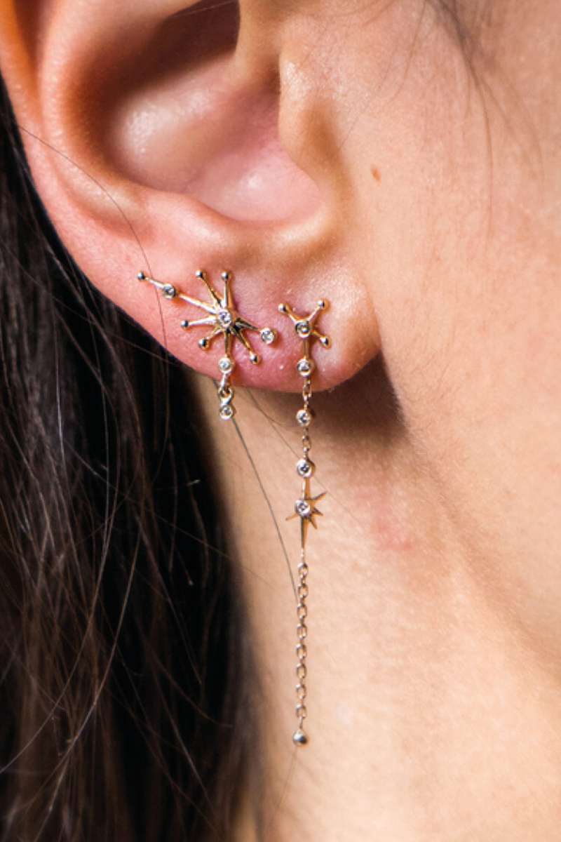 model wearing Diamonds Constellation Earrings 14k light yellow gold
Five white diamonds
One dangling diamond constellation single stud earrings