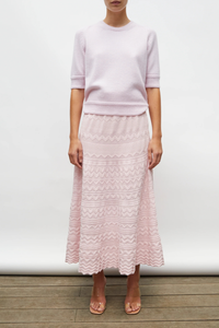 front profile model wearing Diva Pointelle Skirt Rose pink Structured knit
Wide zigzag-style waves
Pointelle knit
Wide scalloped waistband
Fine knit