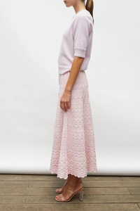 side profile model wearing Diva Pointelle Skirt Rose pink Structured knit
Wide zigzag-style waves
Pointelle knit
Wide scalloped waistband
Fine knit