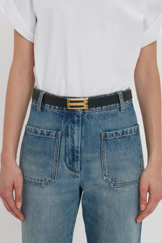 front profile model wearing Dorian Frame Belt Black 2.5 centimeter Luxury gold plated hardware
100% Calf Leather