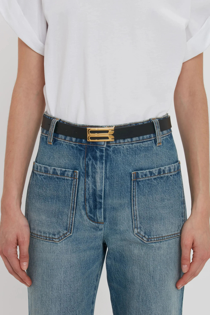 front profile model wearing Dorian Frame Belt Black 2.5 centimeter Luxury gold plated hardware
100% Calf Leather