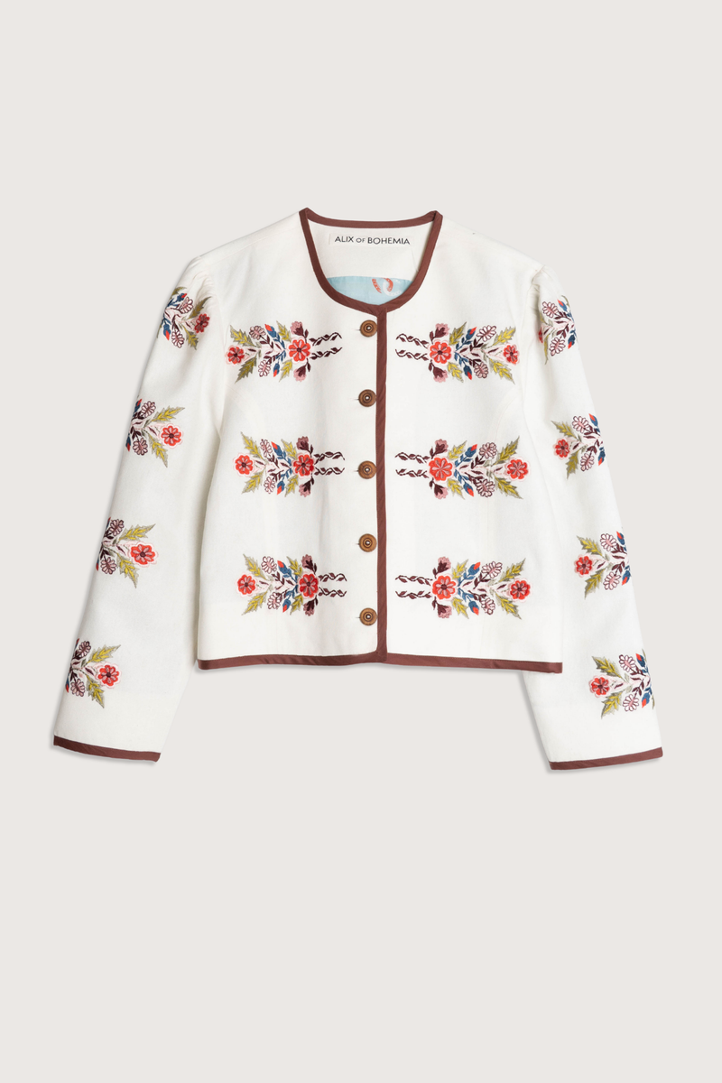 flat lay Dorian Heirloom Flora Jacket Cropped jacket
5 Button front closure
Crewneck
Piping throughout collar, hem and cuff
Floral print
