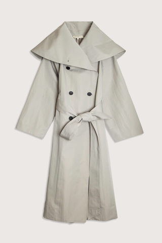 flat lay Dorothy Trench Coat fog grey 
Dramatic oversized shawl collar drapes across the shoulders 
Double breasted closure with contrast buttons and self tie belt at the waist
Welt pockets at front
 dropped shoulders and bracelet length sleeves mid calf length cotton nylon blend