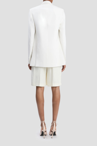 back profile model wearing Double Breasted Tailored Jacket ivory Fluid textured twill jacket
Oversized fit
Finishes below the hip
Front jet pockets with flaps
Welt chest pocket
Hidden button closure
Closed sleeve vent
Internal chest pocket
Double back vents