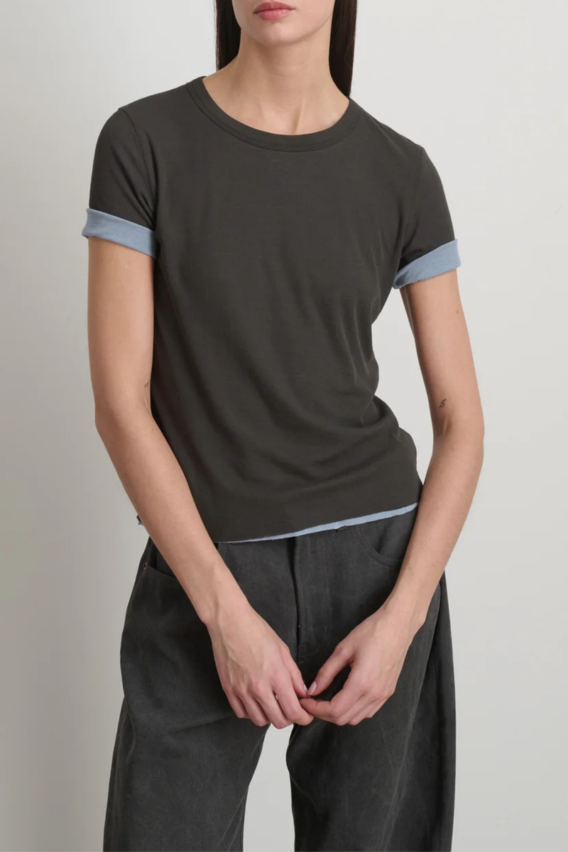 front profile model wearing Double Crepe Jersey Tee Dark Grey/Blue cotton  two-tone look sleeves
Luxe second skin short sleeve crew neck fit
Set-in sleeves
Blind stitch finishing details