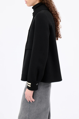 side profile model wearing  Double Face Double Breast Jacket black Double-breasted jacket
Classic collar
Slightly flared fit
Patch flap pockets
Sleeves with cuffs and buttons
Back yoke with seam detail
Material: 80% wool, 20% cashmere