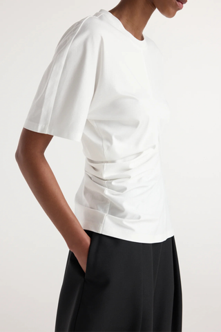 side profile model wearing  Draped Short Sleeve T-Shirt White Seam detailing down the front brings the fabric together and creates draping throughout the garment
Short sleeve t-shirt
60% cotton 34% modal 6% silk