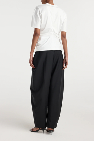 back profile model wearing  Draped Short Sleeve T-Shirt White Seam detailing down the front brings the fabric together and creates draping throughout the garment
Short sleeve t-shirt
60% cotton 34% modal 6% silk
