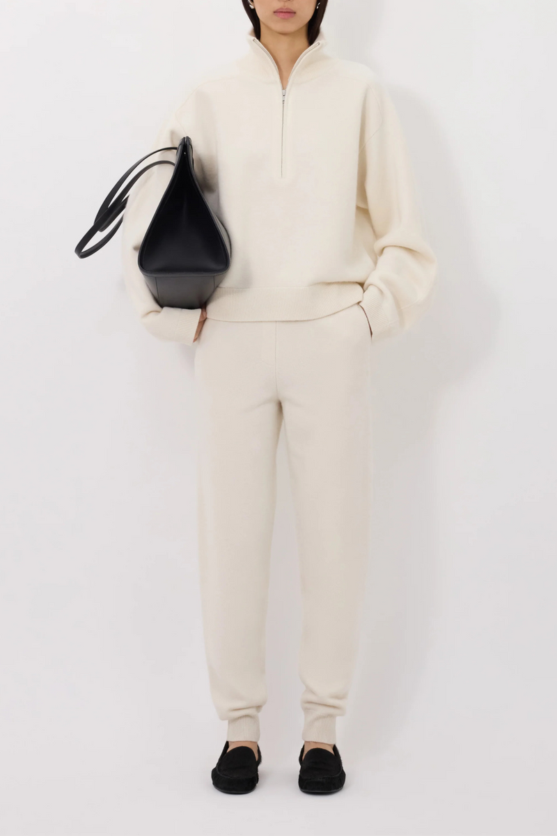 front profile model wearing Dries Stand Collar French Terry ivory cashmere stand collar front zip