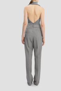 back profile model wearing Drop-Waist Straight Leg Trouser In Light Grey Melange virgin wool high waist front and low waist back design flat front 