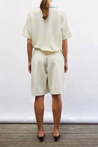 back profile Duc rick-rack edged collar polo natural multi with blue pink lavender collar details Fine knit top
Relaxed cut
Iconic garter-stitch knit
Collar decorated with three narrow, graded-color rickracks
Milano edges at the bottom