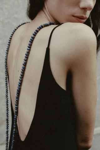 model wearing Dusk Necklace Continuous strand
Blue lapis beads
Generous length
Worn long, doubled or layered
Necklace length 120cm