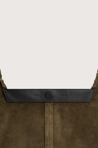 inside magnetic closure detail for  East Tote Suede Bag padron deep brown Shoulder, or hand carry
Seamless sides
Triangular exterior silhouette
Rounded top
Flat base 
100% Calfskin Suede