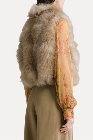 back profile model wearing Eco Siberian Husky Faux Fur Vest mandoria Drawstring at the hem
Gathered back
Classic clasps
Internal lining
Side in–seam pockets