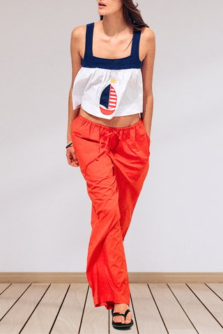 front profile model wearing Eemanno Poplin Pant wide leg red orange cotton with pockets