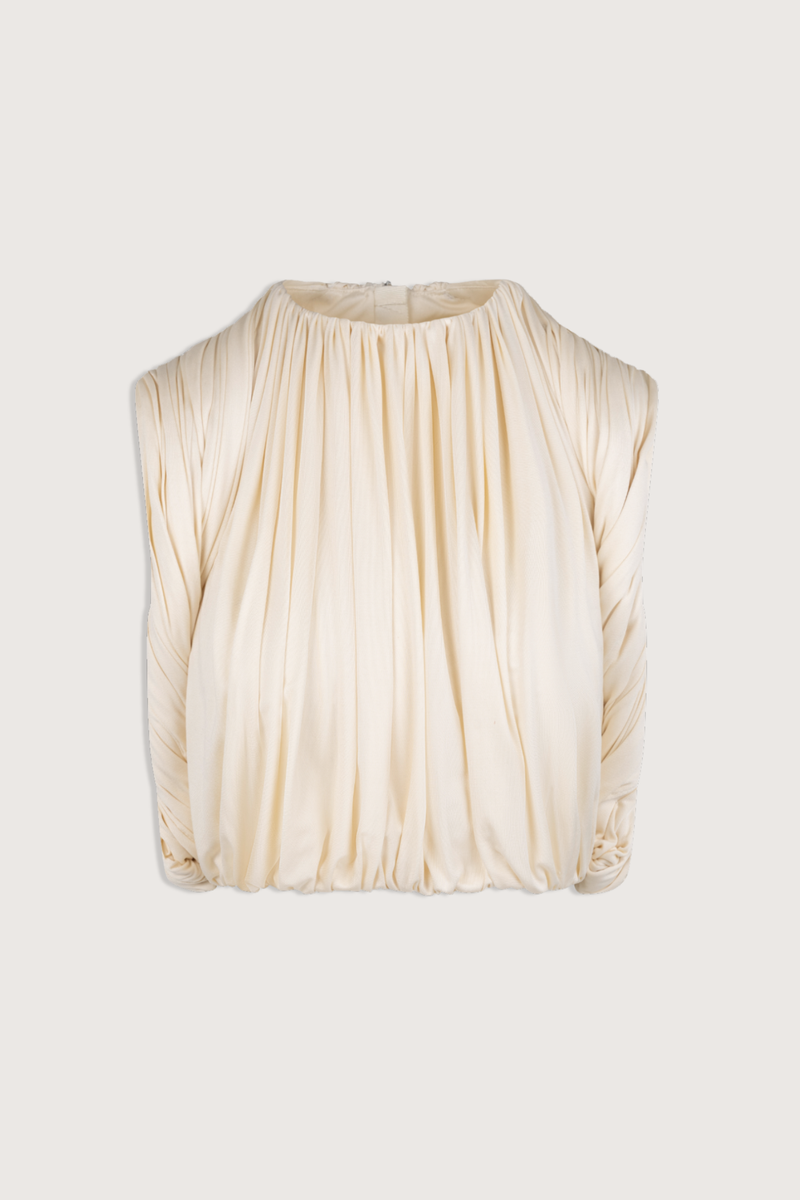 flat lay Effie Silk Jersey Top Bone white Cropped
Crew neck top
Silk jersey fabric
Twisted armhole detail
Shirred fabric throughout front and back body is hand-sewn into place attached to silk lining
Armholes are twisted jersey fabric that is draped around opening
Center back zipper for closure
Interior waist elastic for comfort
Self: 100% Silk