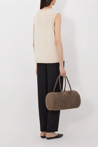 back profile model wearing Effy Boxy Sweater Vest Natural Sleeveless sweater
Boxy fit
Rolled stand collar
Ribbed details on the neckline, armholes and hem