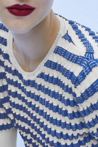 close up texture detail for Egee Sailor Sweater blue white stripe Waffled stitch
Elbow-length sleeves
Round neckline
Slightly wider ribbed hem and cuffs
Lightweight jacquard knitting