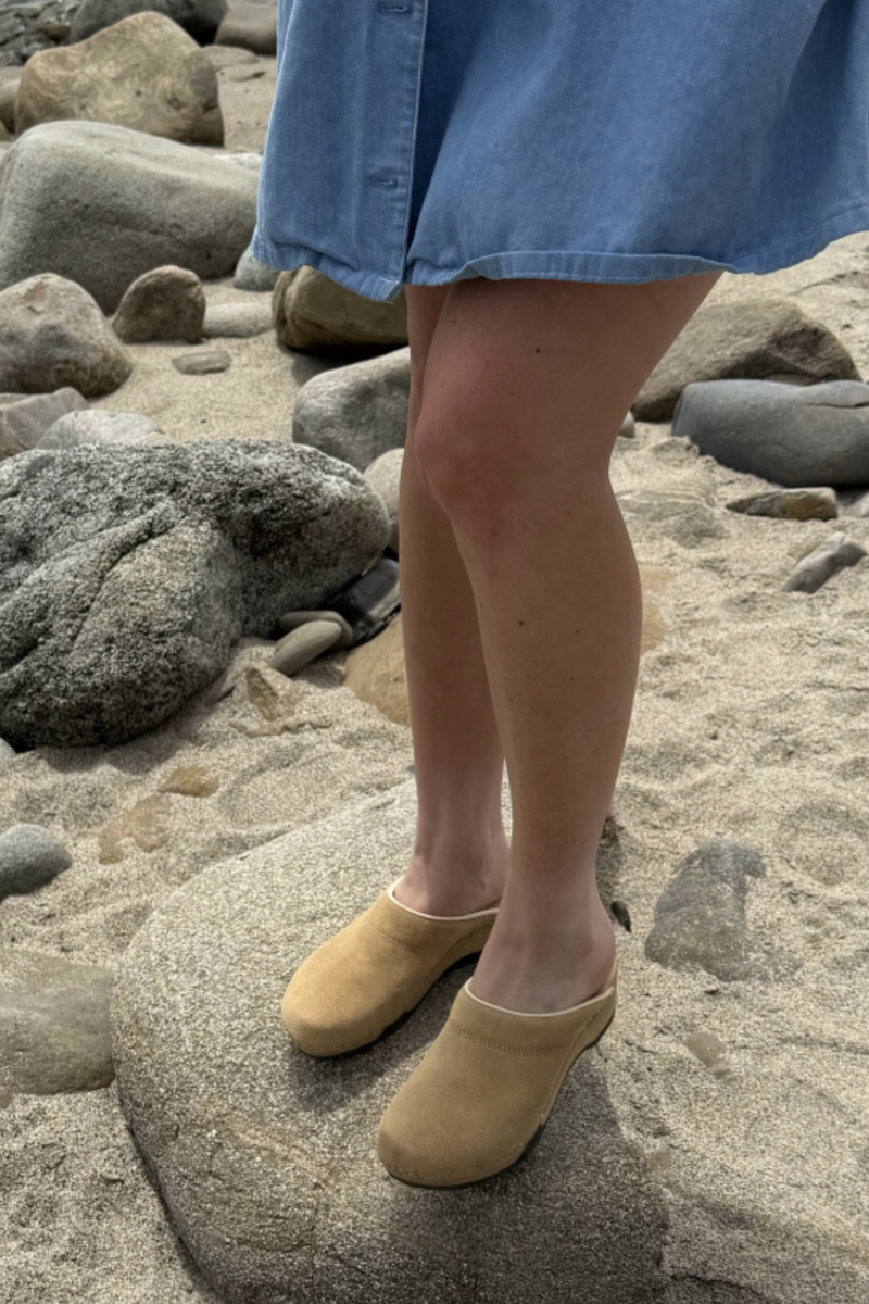 model wearing Embla Clog dune beige 100% premium Italian suede upper classic clog style,
Soft collar for instep
Breathable vegan inner lining, wood and natural rubber sole