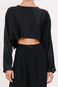 front profile model wearing Emilia Crop Top Black long sleeve raw hem