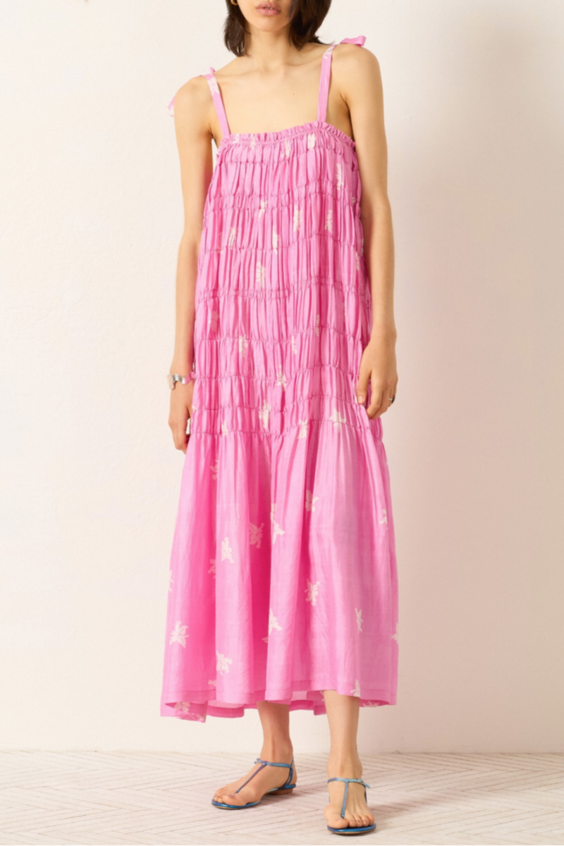 front profile model wearing Emrys Pink Jasmin Silk Dress medium pink Cut from hand-loomed silk
Relaxed maxi dress
Fluid drape
Ruched tiers
Tie shoulder straps
Hand-block-printed
Asymmetrical jasmine motif