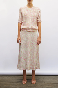 front profile model wearing Enjoue Mini Origami Knit Cardigan Natural/Pink natural pink multi Short sleeves
Lovely volume
Ruffled trim at the waist and cuffs
Origami knit
Round neckline
Front closure with small buttons