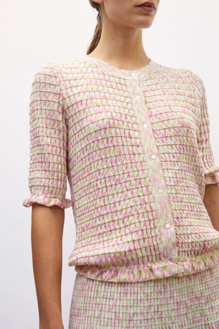 close up texture detail for Enjoue Mini Origami Knit Cardigan Natural/Pink natural pink multi Short sleeves
Lovely volume
Ruffled trim at the waist and cuffs
Origami knit
Round neckline
Front closure with small buttons