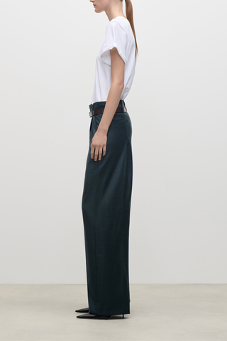 side profile model wearing  Ethel Classic Wool Pant Tailored trouser marsh green
Refined construction
Mid waist
Pleat detail at waist
Dual belt loop for a regular or slim belt allowing the trouser to be worn mid waist or as a paperbag style
Traditional tailored trouser fastening with side entry and back jet pockets
100% Virgin Wool