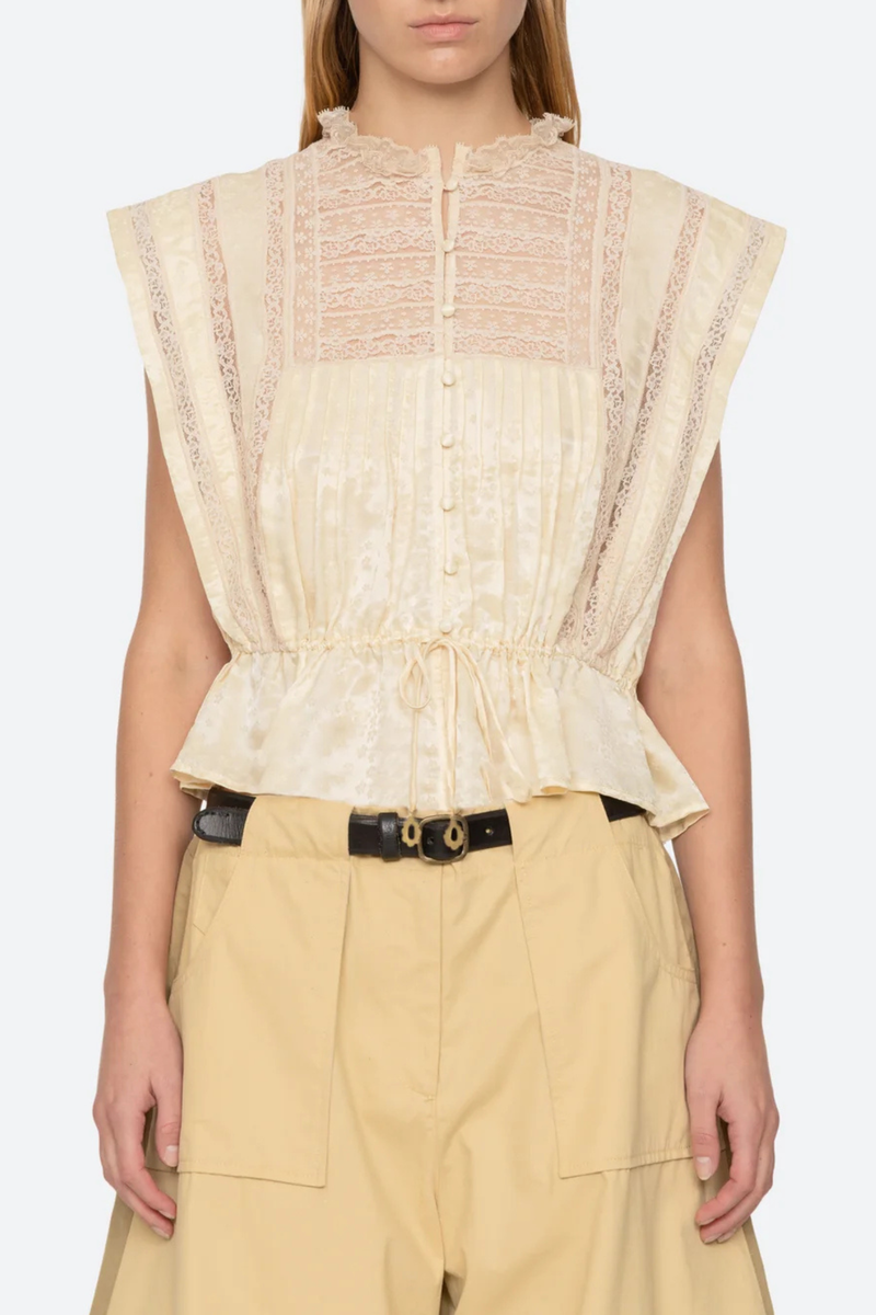 front profile model wearing Ethel Top yellow Delicate floral motif
Lace inserts throughout
Adjustable drawstrings at the waist