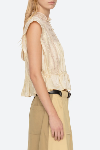 side profile model wearing Ethel Top yellow Delicate floral motif
Lace inserts throughout
Adjustable drawstrings at the waist