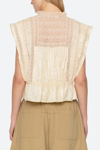 back profile model wearing Ethel Top yellow Delicate floral motif
Lace inserts throughout
Adjustable drawstrings at the waist