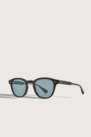 angled profile Evan Sunglasses black rame blue lens round shape