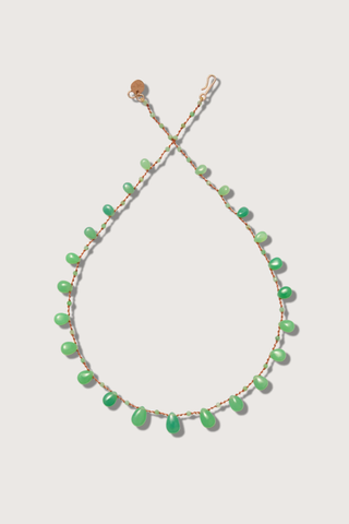 flat lay Evergreen Chrysoprase Necklace Delicate alternation of round beads and drops
Separated by three meticulous knots
Flows gracefully along a silky nylon cord
38 carats
14K Gold-filled 'Infinity' Clasp