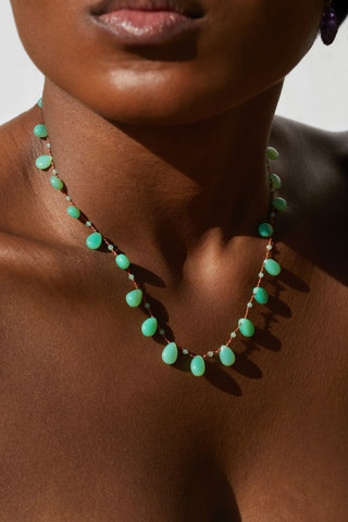 model wearing Evergreen Chrysoprase Necklace Delicate alternation of round beads and drops
Separated by three meticulous knots
Flows gracefully along a silky nylon cord
38 carats
14K Gold-filled 'Infinity' Clasp