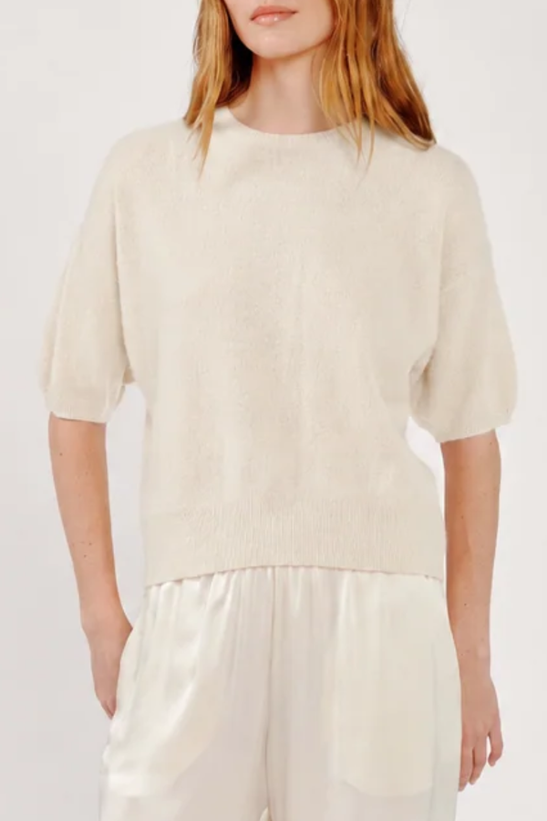 front profile model wearing Evie Relaxed Short Sleeve Sweater Gardenia white
Cashmere knit
Relaxed body
Ribbed trim
100% Cashmere
12 Gauge, 1 Ply Cashmere Jersey Stitch