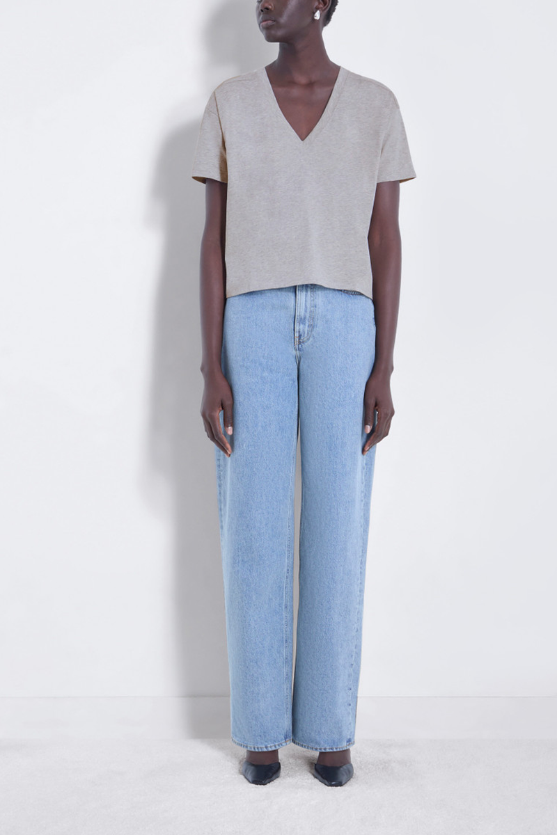 front profile model wearing FAAA V-Neck Tee Grey Melange supima cotton boxy fit
