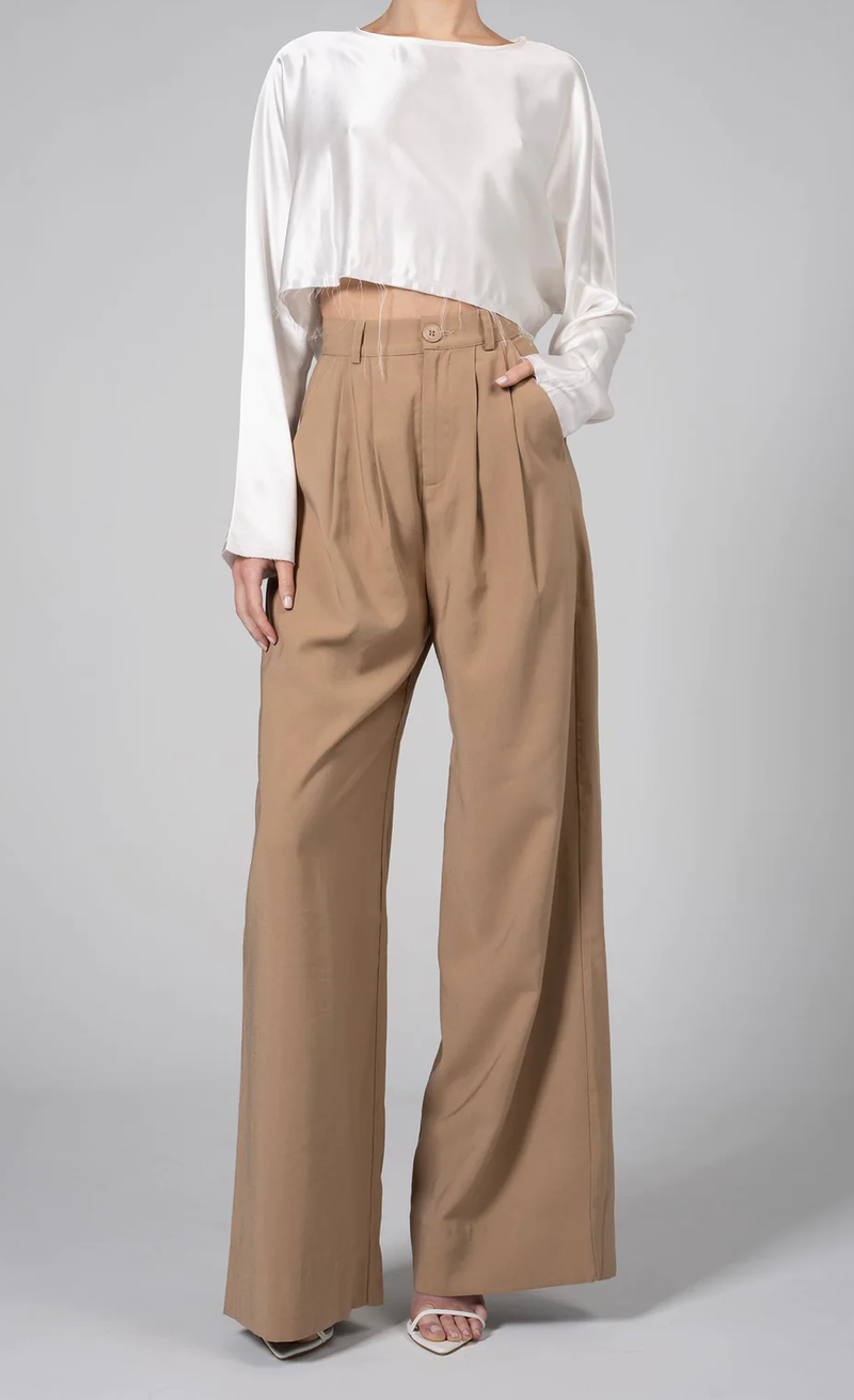 front profile model wearing Fabi Pant Camel high rise wide leg pleated