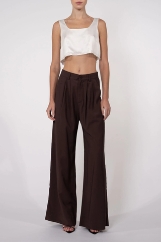 front profile model wearing Fabi Pant Chocolate high rise pleated wide leg 