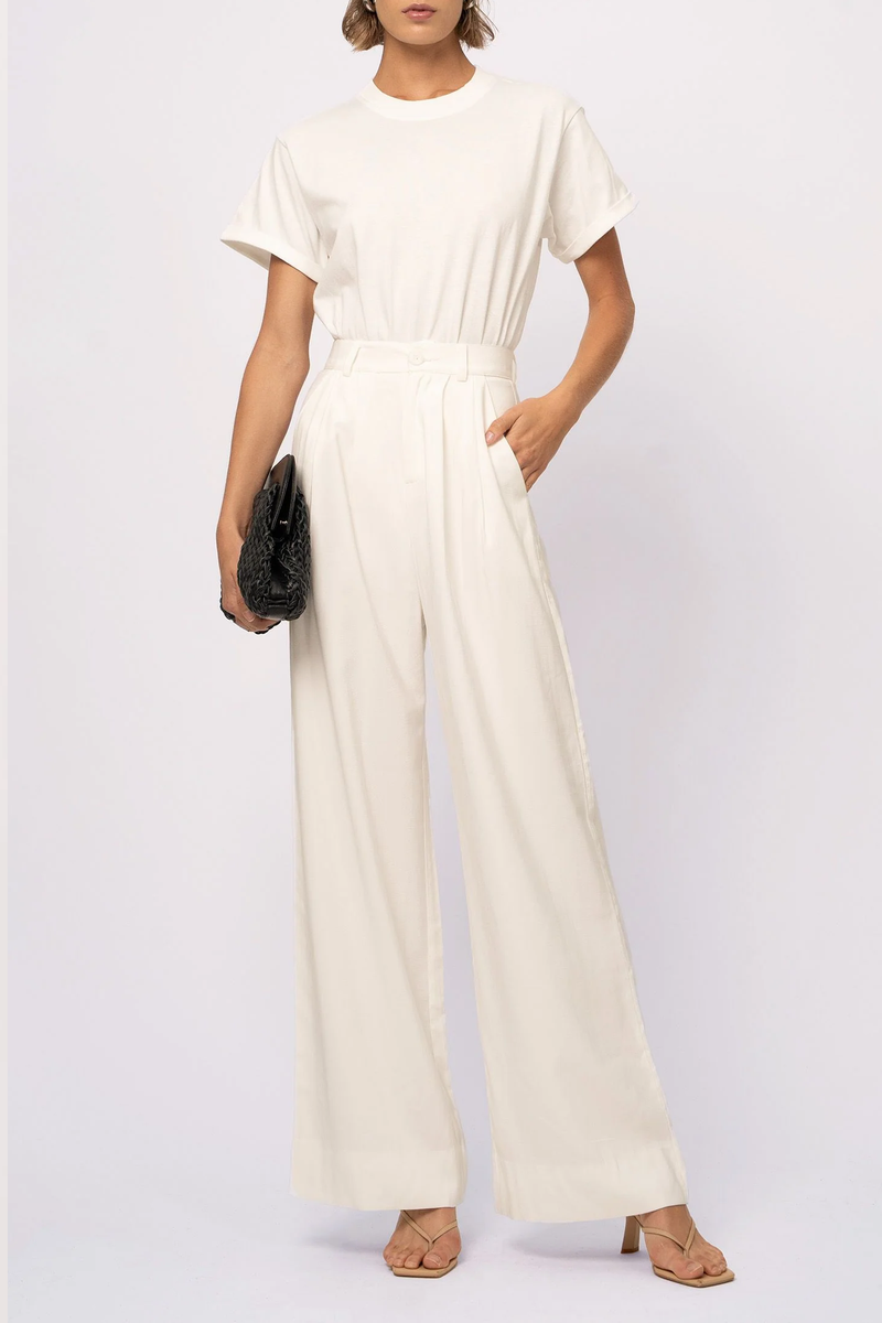 front profile model wearing Fabi Pant White wide leg pleated high rise