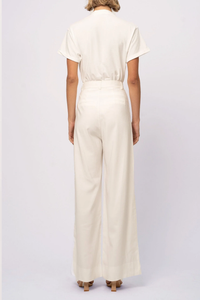 back profile model wearing Fabi Pant White high waisted wide leg pleated